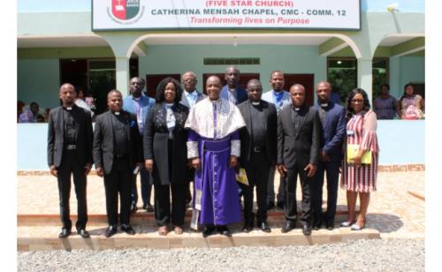 NEC IN A GROUP PHOTOGRAPH WITH ORDAINED PASTORS